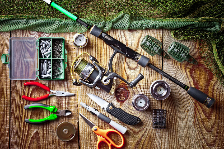 Fishing equipment laid out on table