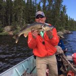 Man Holding Walleye in Saskatchewan