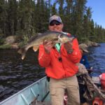 Man Holding Walleye in Saskatchewan