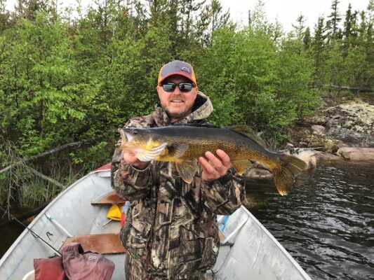 Showing off Fish caught in Reindeer Lake