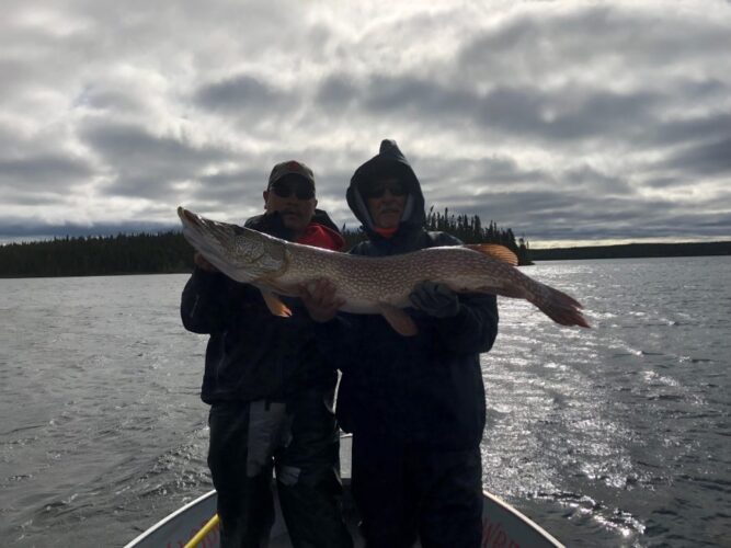 2 Men Holding Northern Pike