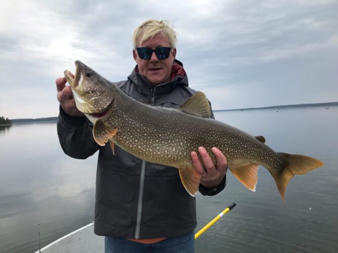 Man with Fish Caught in Reindeer Lake