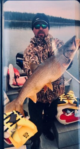 Man in Camo with large Fish