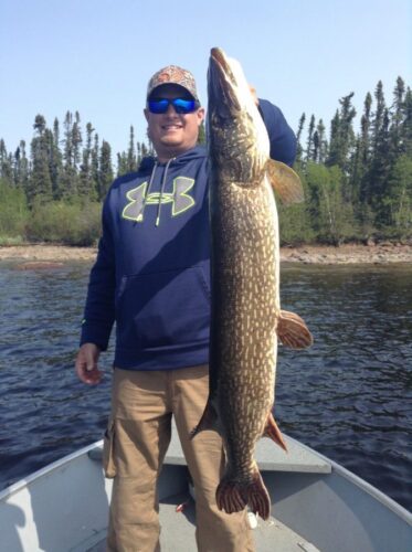 Man Showing Large Northern Pike