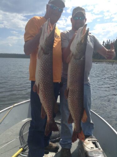 2 Men showing off their Catch