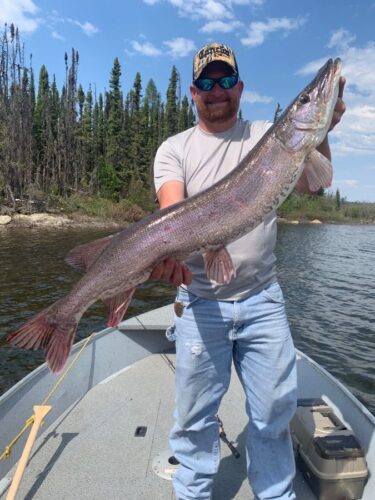 Man Holding Large Northern Pike