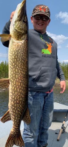 Boy Holding Large Northern Pike