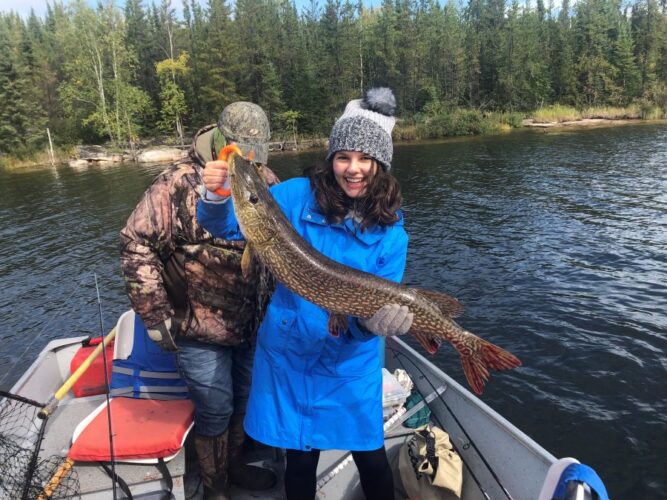 Woman holding Northern Pike