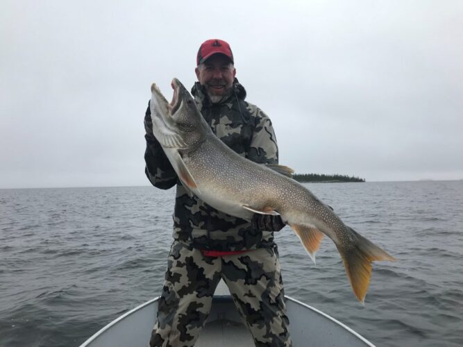 Man on Reindeer Lake Fishing