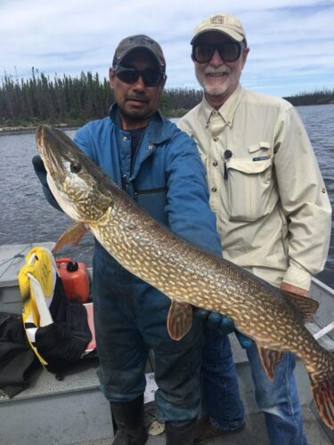 2 Men Showing a Fish
