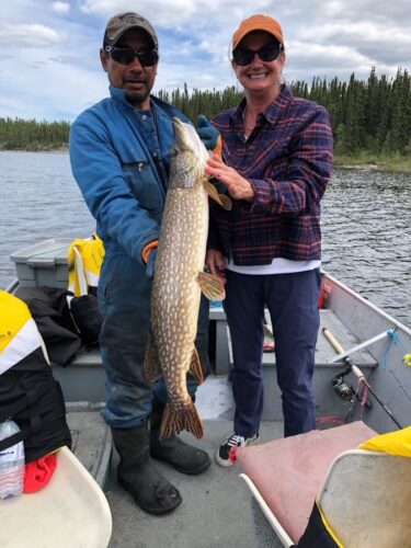 2 Men with Newly Caught Fish