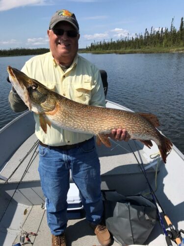 Man in Yellow Shirt with Northern Pike